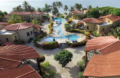 San Pedro Villa | Be right on the beach with a designer pool and your own tennis/pickleball court!