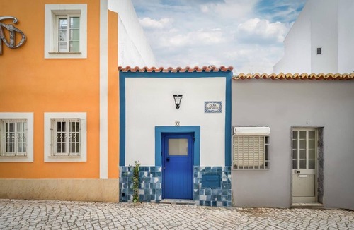 Portimao City Centre Apartment | Charming historic tiny house in Portimão's vibrant old town, steps from the marina and promenade. Easy access to Algarve beaches. Sleeps 4. Pets welcome. Self check-in via lockbox.