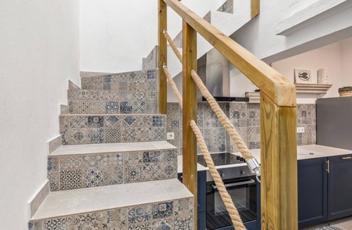 Portimao City Centre House | Just steps from Portimão's promenade, marina and beaches, this stylish home offers AC, sun deck with jacuzzi, a fully equipped kitchen and comfortable living spaces. Perfect for families, friends or business stays exploring the Algarve.