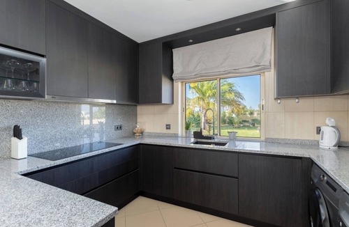 Quarteira Villa | Stunning Villa with Heated Pool, Garden, BBQ, and Wi-Fi Included!