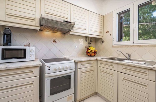 Alpouvar Apartment | Sunny Flat with a Balcony & Pool by HostWise