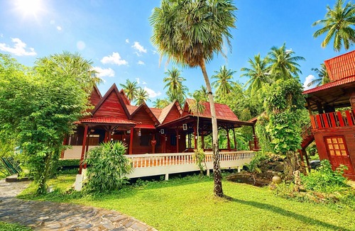 Baan Tai Villa | Welcome Villa Garden a peaceful and spacious home surrounded by lush greenery.