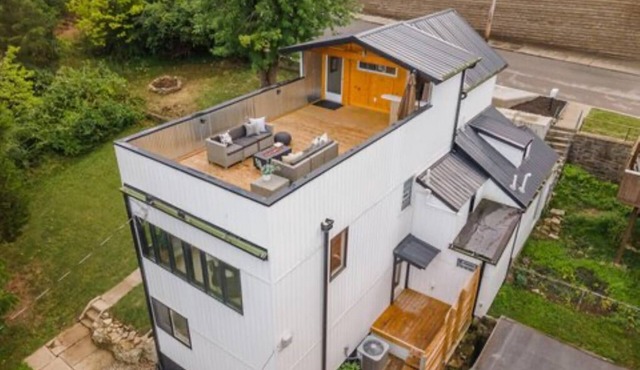 Downtown skyline view featuring giant rooftop deck & wet bar with a city view. in Covington