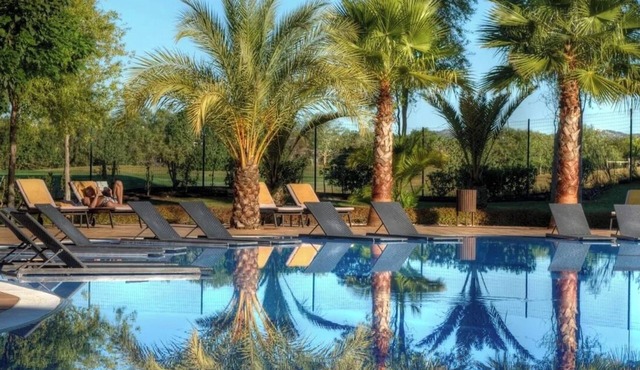 Dual 2-Bedroom Retreats with Pools, Green Views, and Lush Surroundings