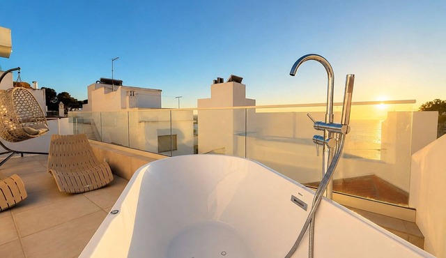 Enjoy exclusive use of two beautifully refurbished townhouses combined into one spacious 4-bedroom home in Alvor Old Town. Steps from the harbour, beach and restaurants, with sunny sea-view terraces jacuzzi, 2living rooms, 2kitchens, AC throughout.
