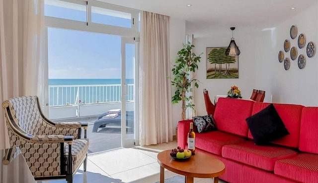 Oura Beach Escapade! Four Relaxing Suites with Kitchenettes, Pool, Beachfront!
