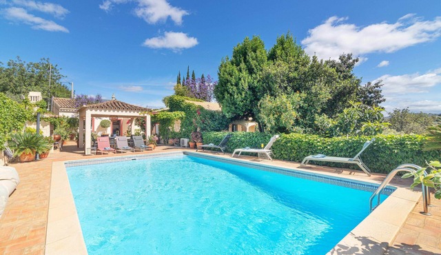 Own house on a 3 villa property with shared pool.