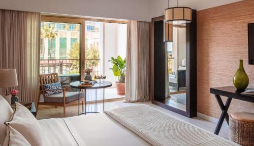 One-Bedroom Suite with Palms Pool View and Balcony