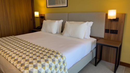 Premium Double Room with Furnished Balcony and Single Sofa Bed