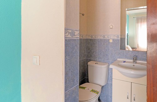 Porto Covo House | Room 'Quarto 12' in Porto Covo with a Fan